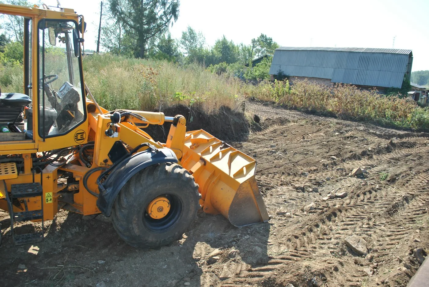 Wheel loader working on disturbed ground