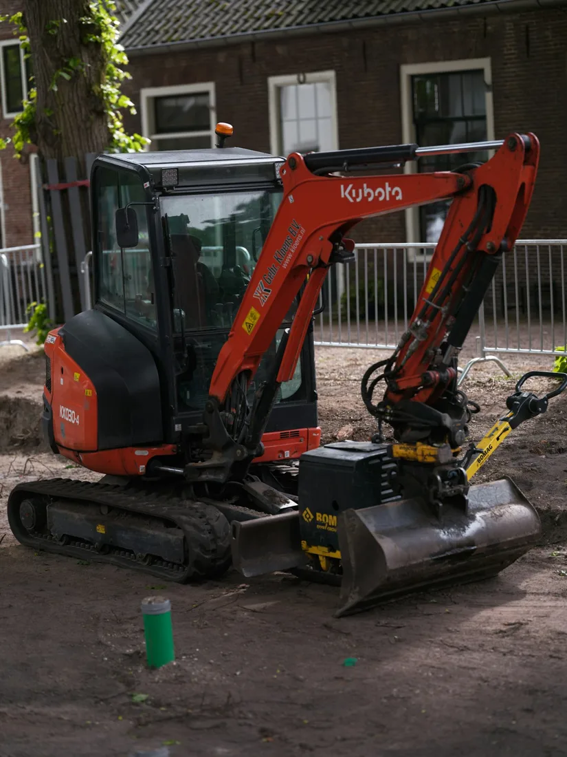 Compact excavator at a residential work area